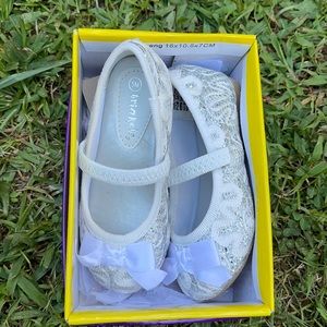 White and silver toddler dress shoes.